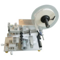 Semi-auto tamp labeler for bottle